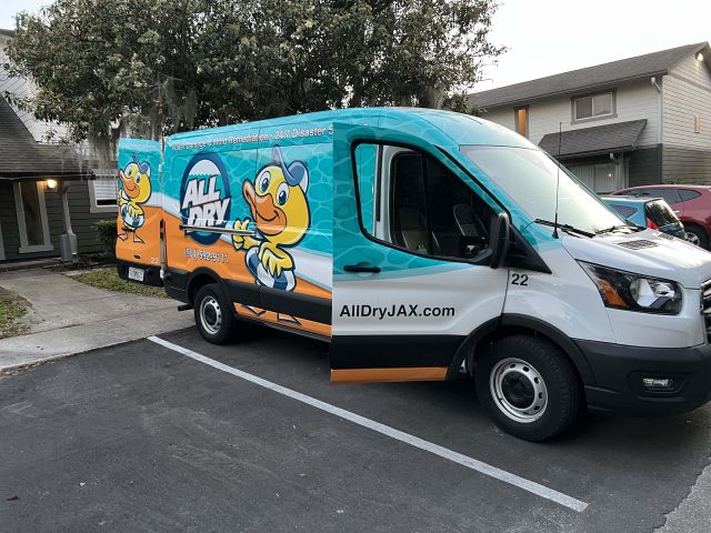 All Dry Services Jacksonville service van with doors open showing the logo and contact info